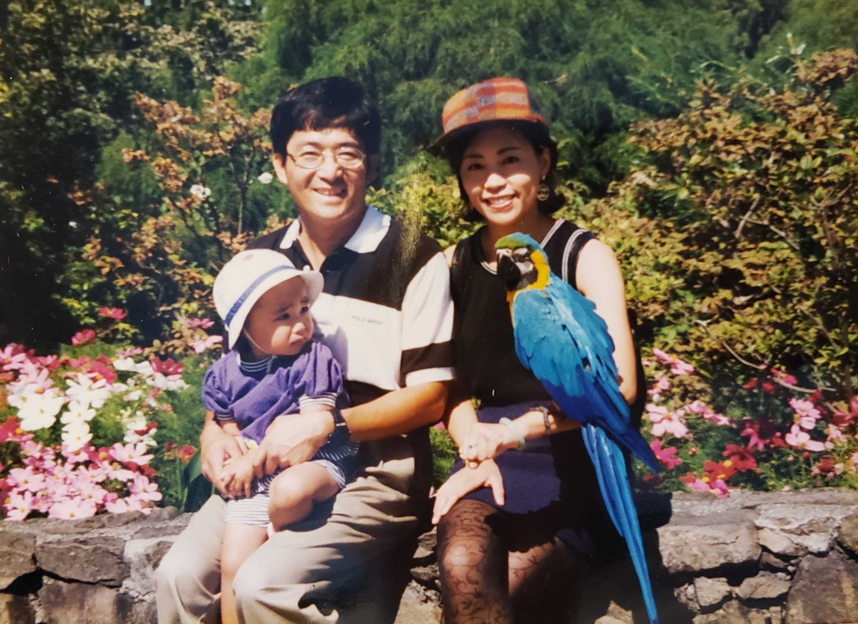 Lin, with her parents, and the aforementioned "giant colorful monster". Courtesy of Christine Lin