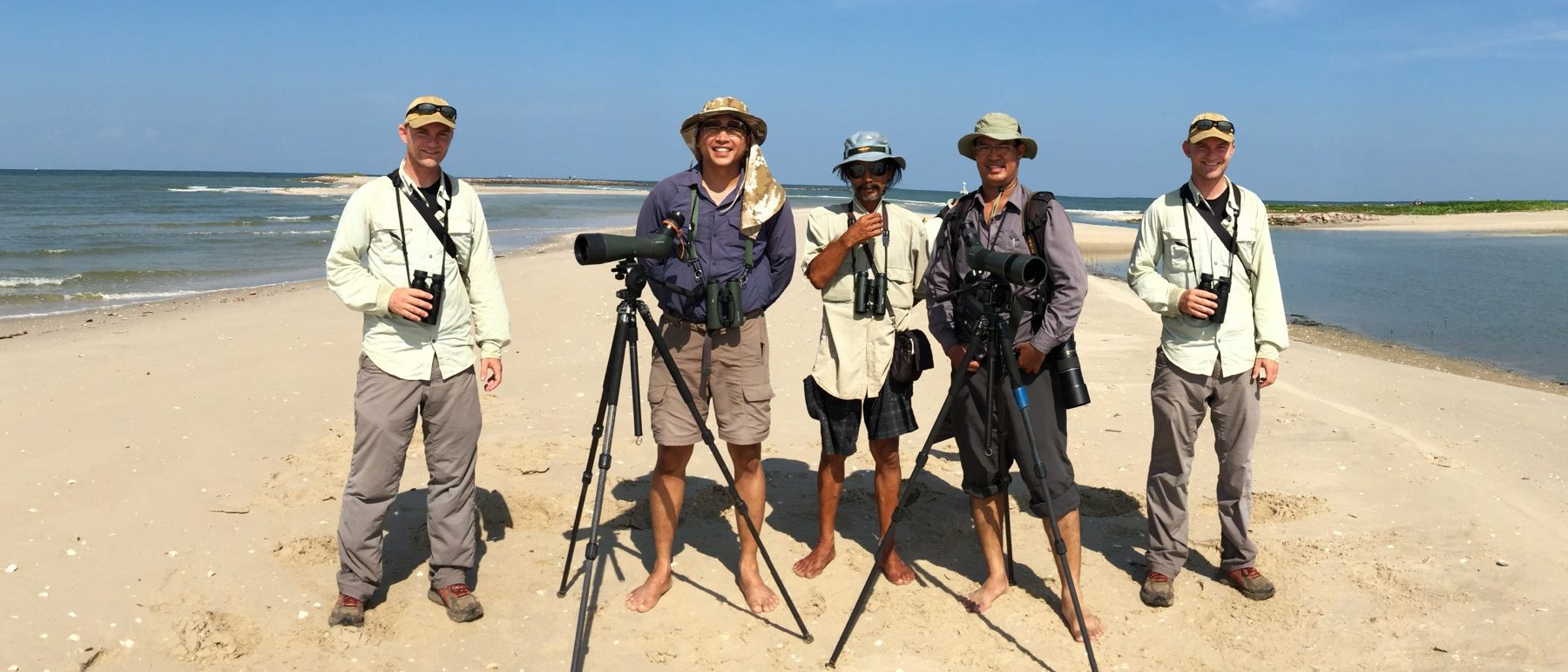 Noah is beside himself with birding friends in Thailand. Panuwat Sasirat
