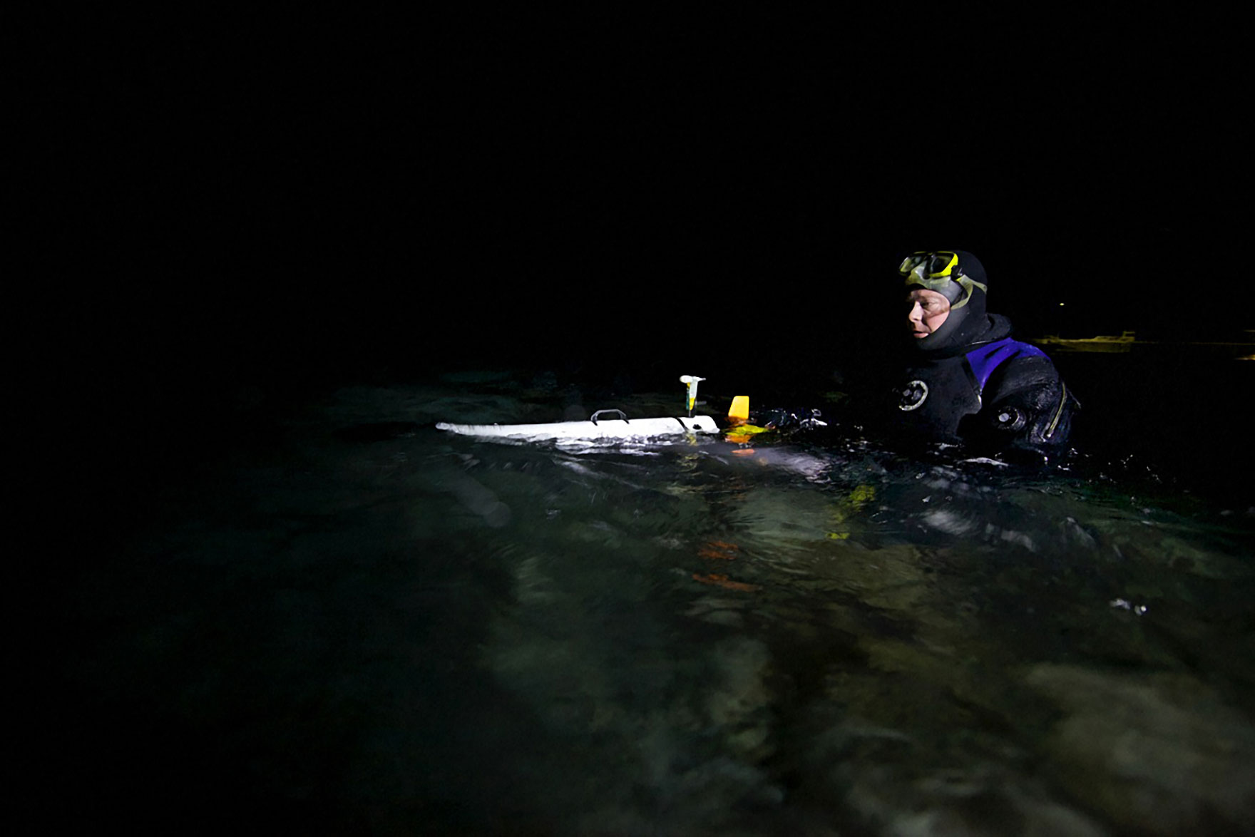 Project leader Jorgen Berge launches an underwater robot that measures temperature, salinity, and density. Geir Johnsen/NTNU