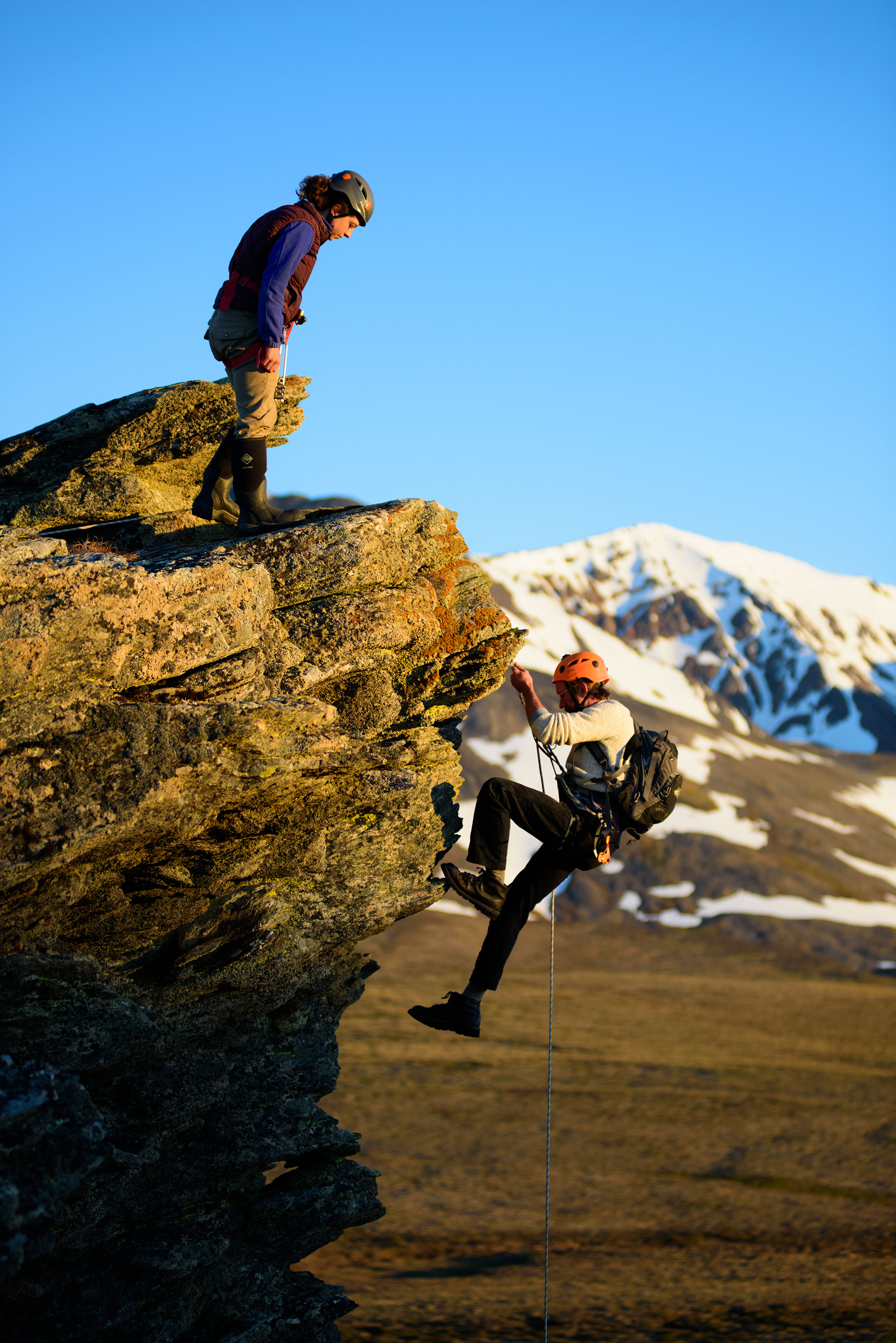 Robinson and Ellen Whittle use rock-climbing tools and techniques to visit Gyrfalcon nests and monitor population health. The birds, which range throughout the circumpolar north, usually remain in the Arctic for the long, dark winter. Gerrit Vyn