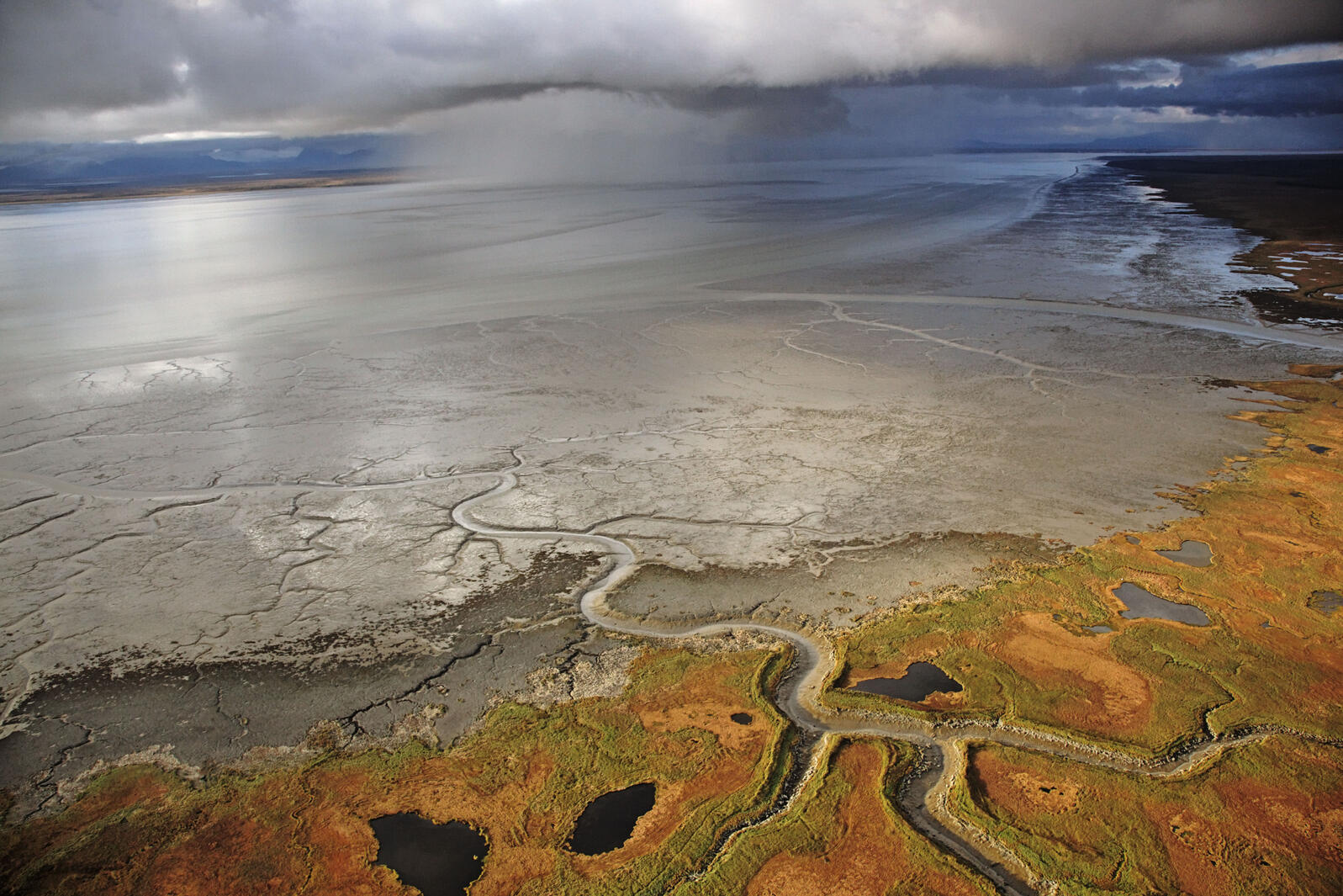 Dark clouds converge over Nushagak Bay, in one of the pristine watersheds that would be threatened by the proposed mine and its toxic tailings ponds. Photograph by Michael Medford/National Geographic Stock