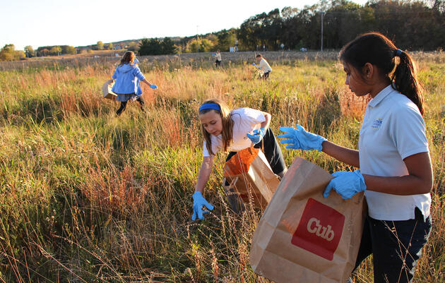 St. Croix Preparatory School students gather native plant seeds for a prairie restoration in Minnesota. Ashley J. Peters