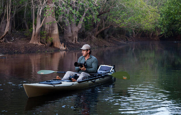 Photographer Carlton Ward Jr. in the Okefenokee Swamp. By using a boat, you're likely to see, and shoot, birds in an entirely new way. Kayaks can usually handle rougher water than canoes, though in open boats can carry more gear. Mac Stone