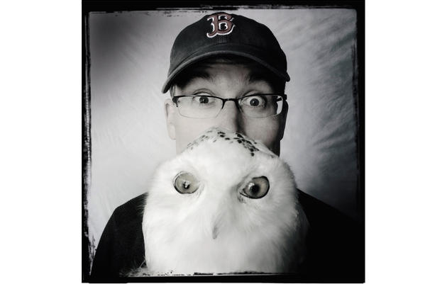 Portrait of Neil Hayward, who in 2013 as a bird spotter had a Big Year spotting 749 species of birds in North America. Owls courtesy of the Blue Hills Trailside Museum in Milton, MA. Photograph by John Stanmeyer