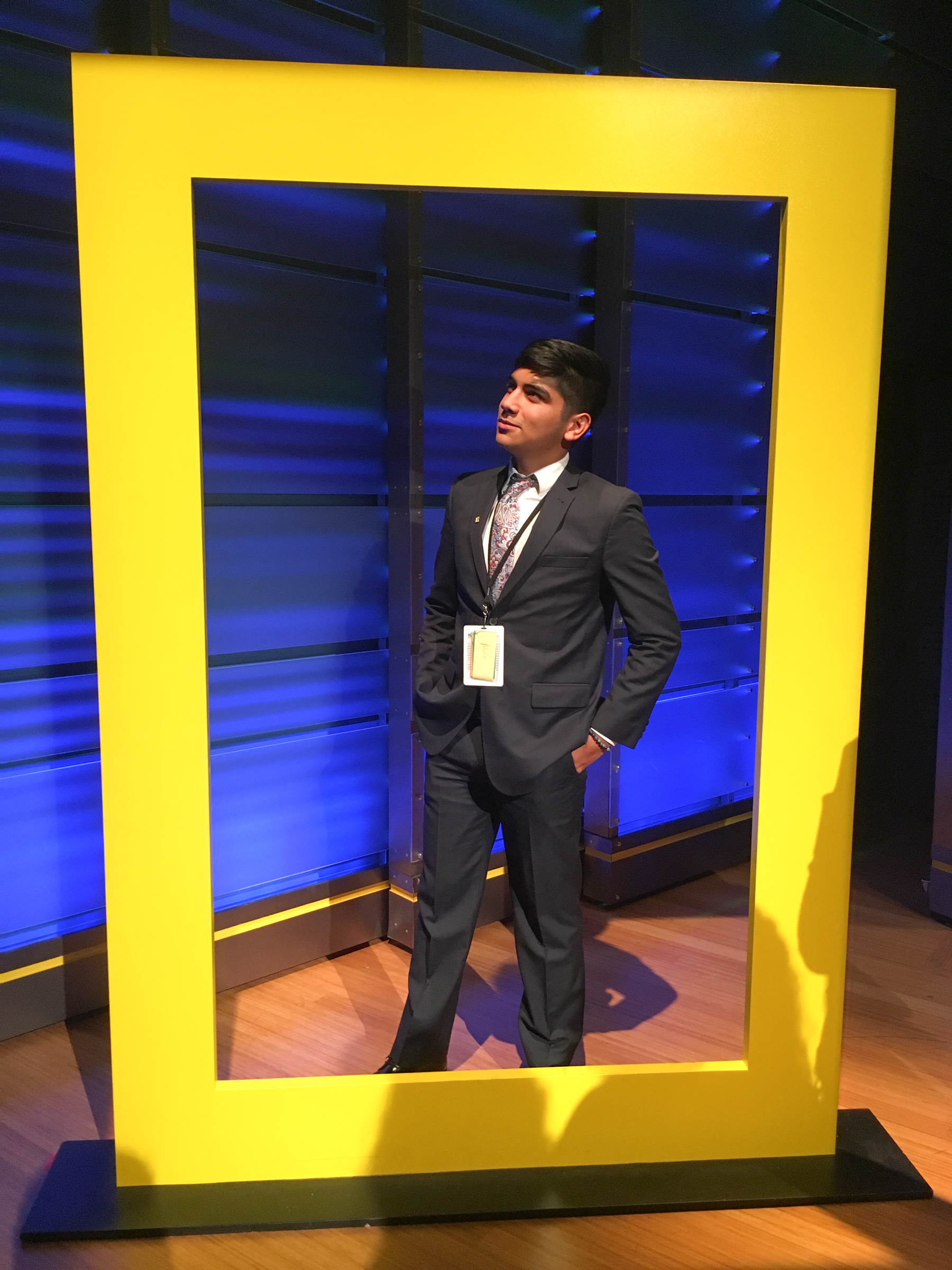 Ponce posing underneath the National Geographic logo at its headquarters in Washington, D.C., where he attended a youth summit on the environment. Courtesy of Alonso Ponce
