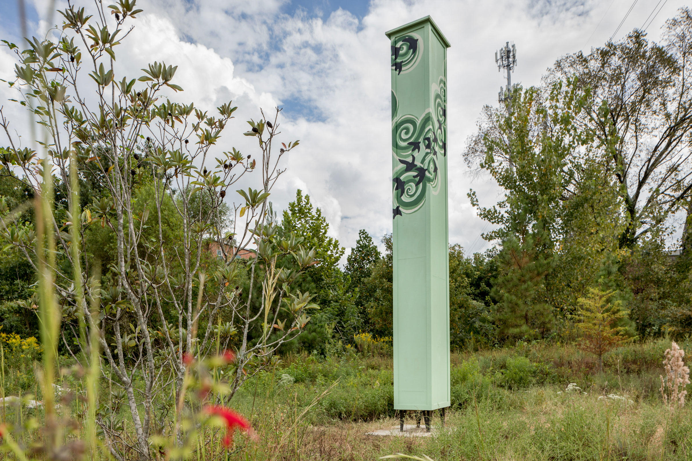 Scarlet sage flowers hem the new Atlanta Audubon swift tower in Piedmont Park. Jessie Parks