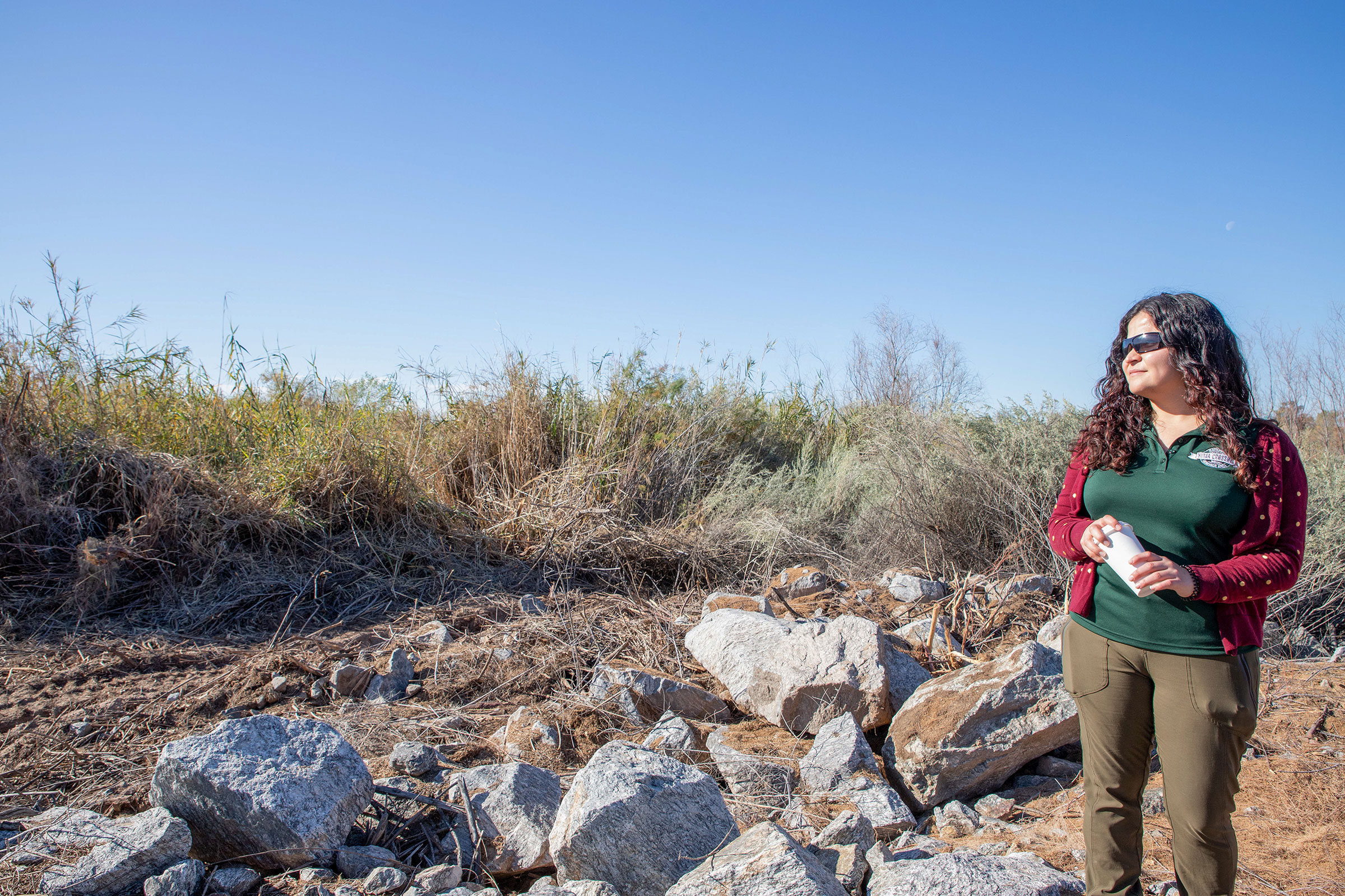 Vianey Avila of the Yuma Crossing National Heritage Area surveys the 17-acre invasive-plant grant project. Yuma, Arizona. Dominic Arenas/Audubon