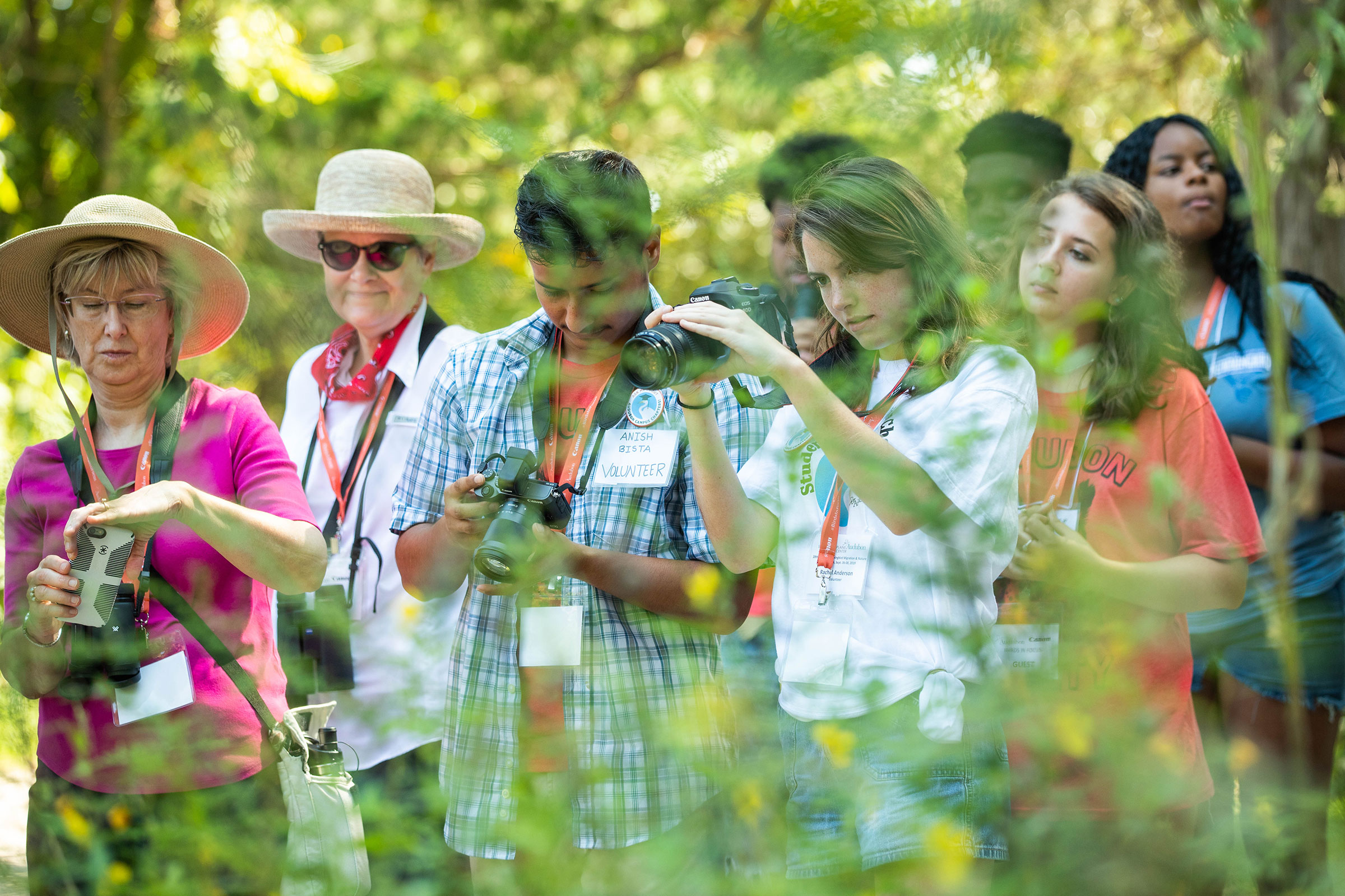 Anish Bista (Left) and Rachel Anderson (Right), members of the Magnolia Grove Audubon chapter at the University of Mississippi, test out Canon gear on a "Birds in Focus" walk. Dominic Arenas/Audubon