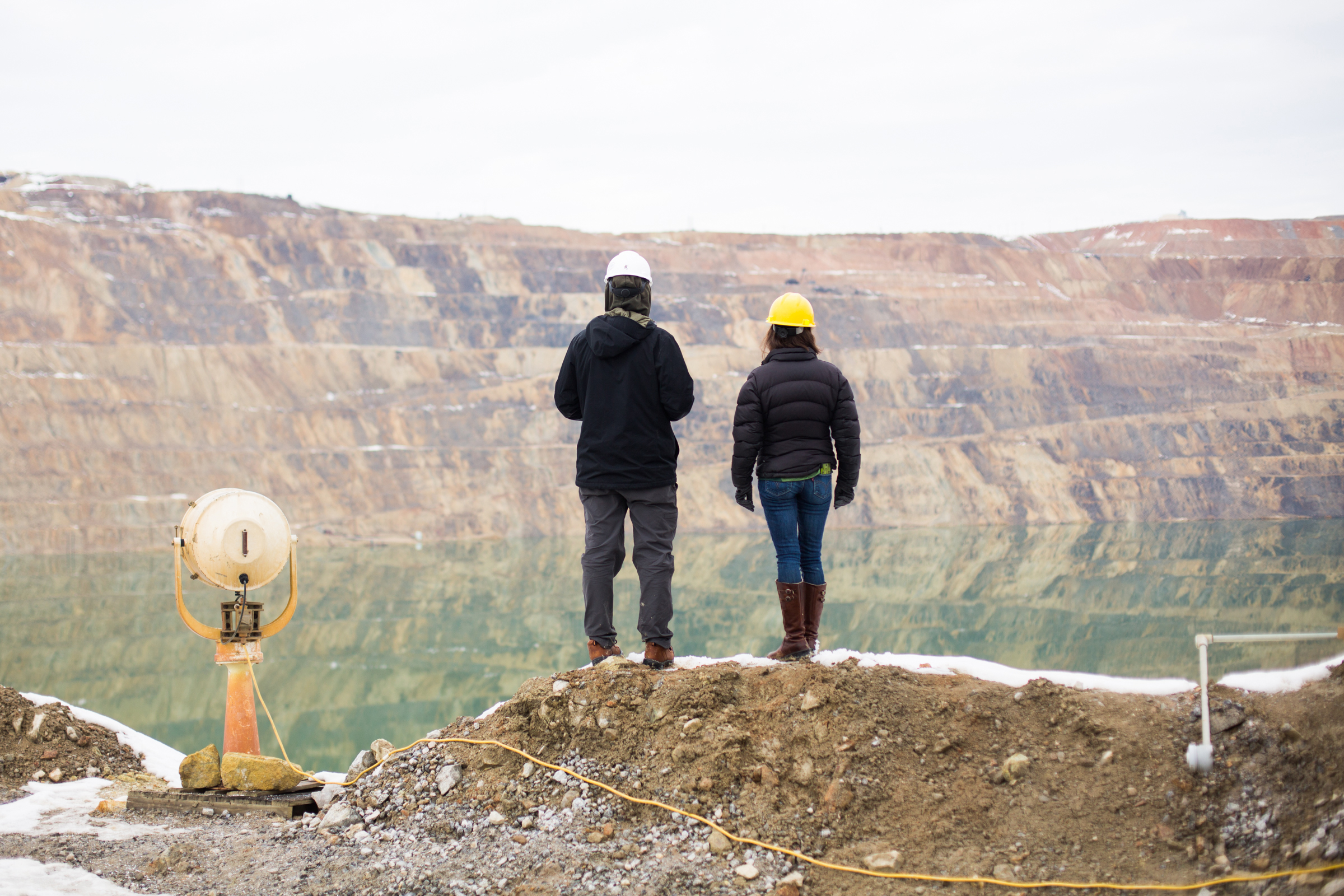 Stella Capoccia (right) and Mark Mariano Jr. look out over the pit. To their left sits a searchlight that was formerly installed in a prison and is now used to spotlight birds at night. Celia Talbot Tobin