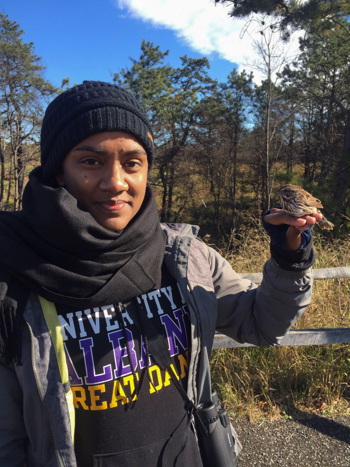 Bird banding at the Albany Pine Bush Preserve while pursuing her master’s degree in Biodiversity, Conservation, and Policy at the University at Albany in 2019. Courtesy of Vero Couttee