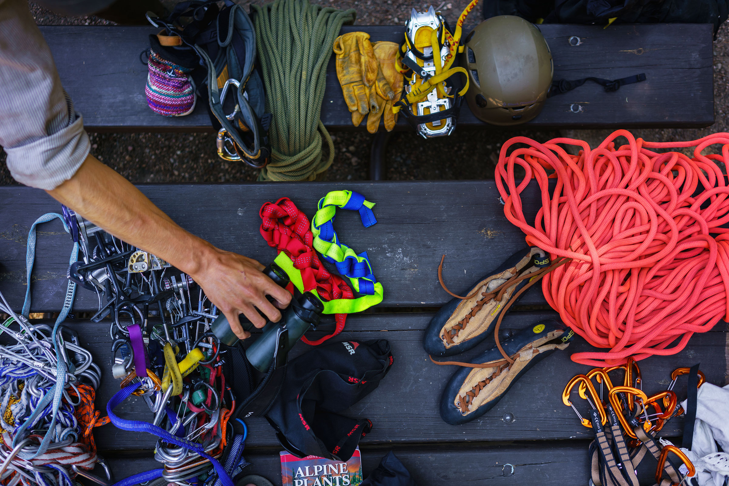 Prepping climbing gear to rappel to the site of inactive Black Rosy-Finch nests. Ronan Donovan