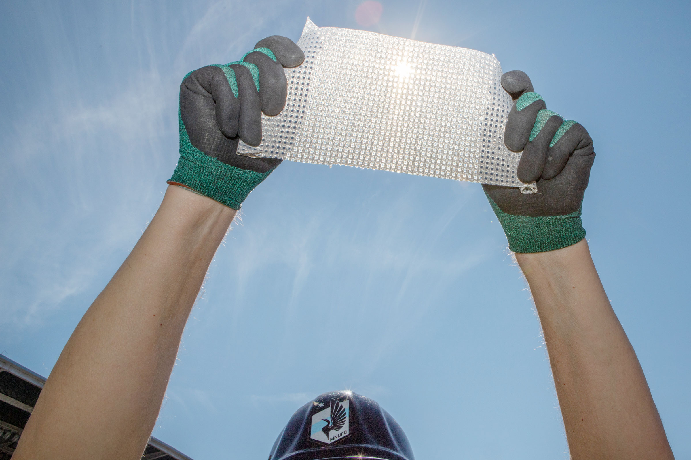 McGuire holds up a piece of the PTFE wrap. Before deciding on the material, it was put through rigorous testing to make sure it could withstand the weather extremes that the Twin Cities experience. Camilla Cerea/Audubon