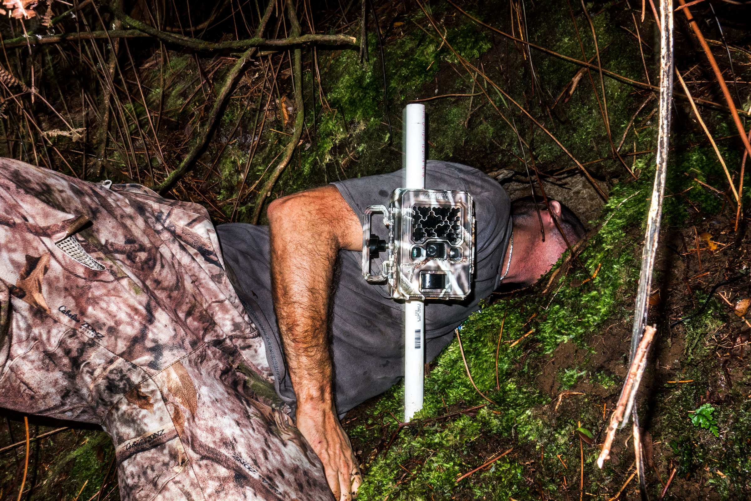 Raine checks a Hawaiian Petrel burrow in the Pōhākea area of the reserve. Tom Fowlks