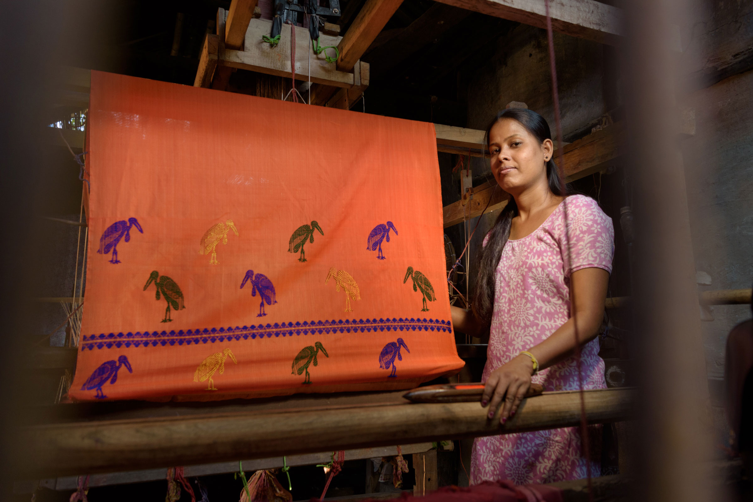 Sangita makes traditional mekhala chadar with hargila motifs at her home in Dadara Village, Assam. Photo: Smita Sharma