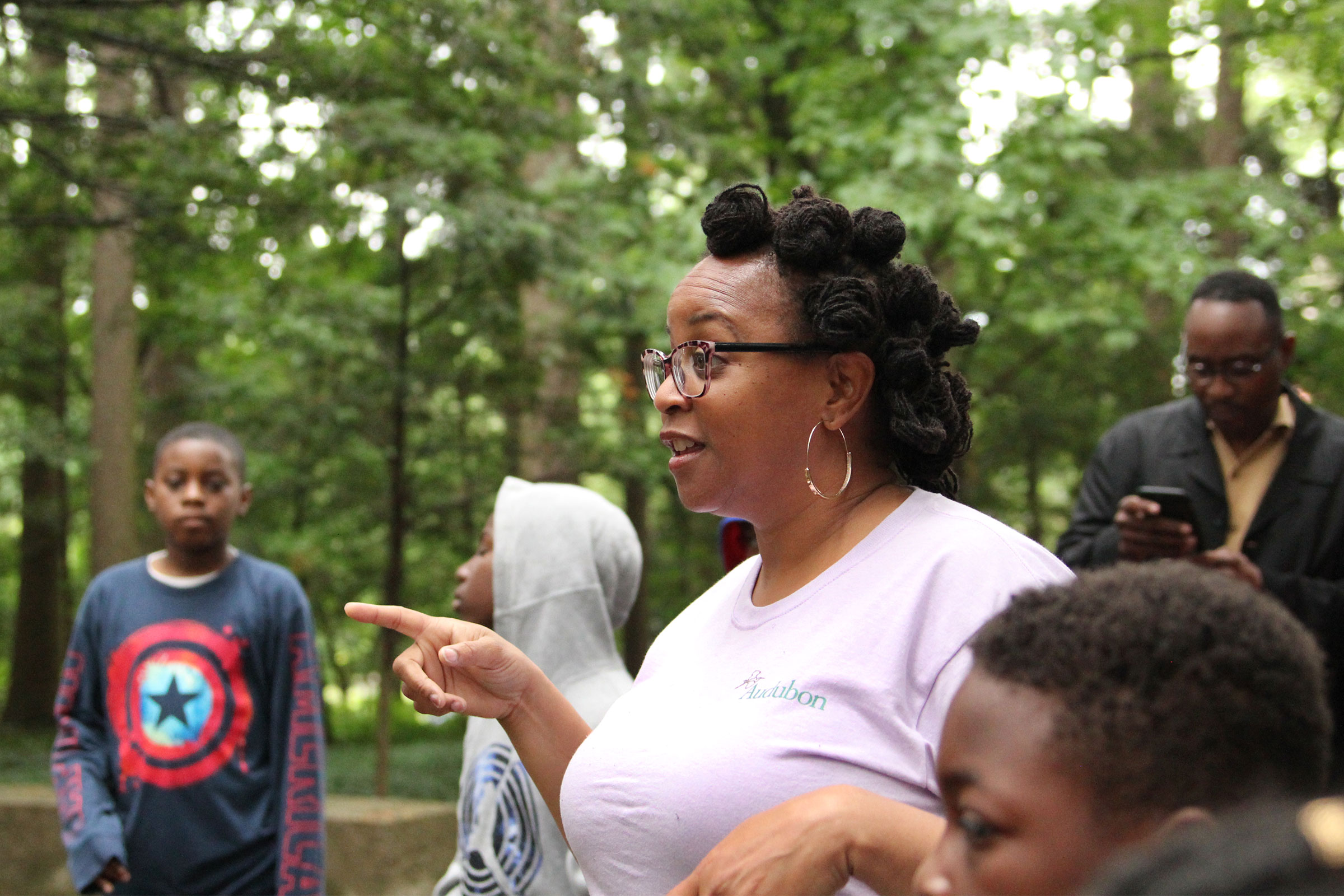 Sanaa Green, a fellow with the Wild Indigo program, discusses nature with middle-school students at Cranbrook House and Gardens. Eileen Solange Rodriguez/Audubon