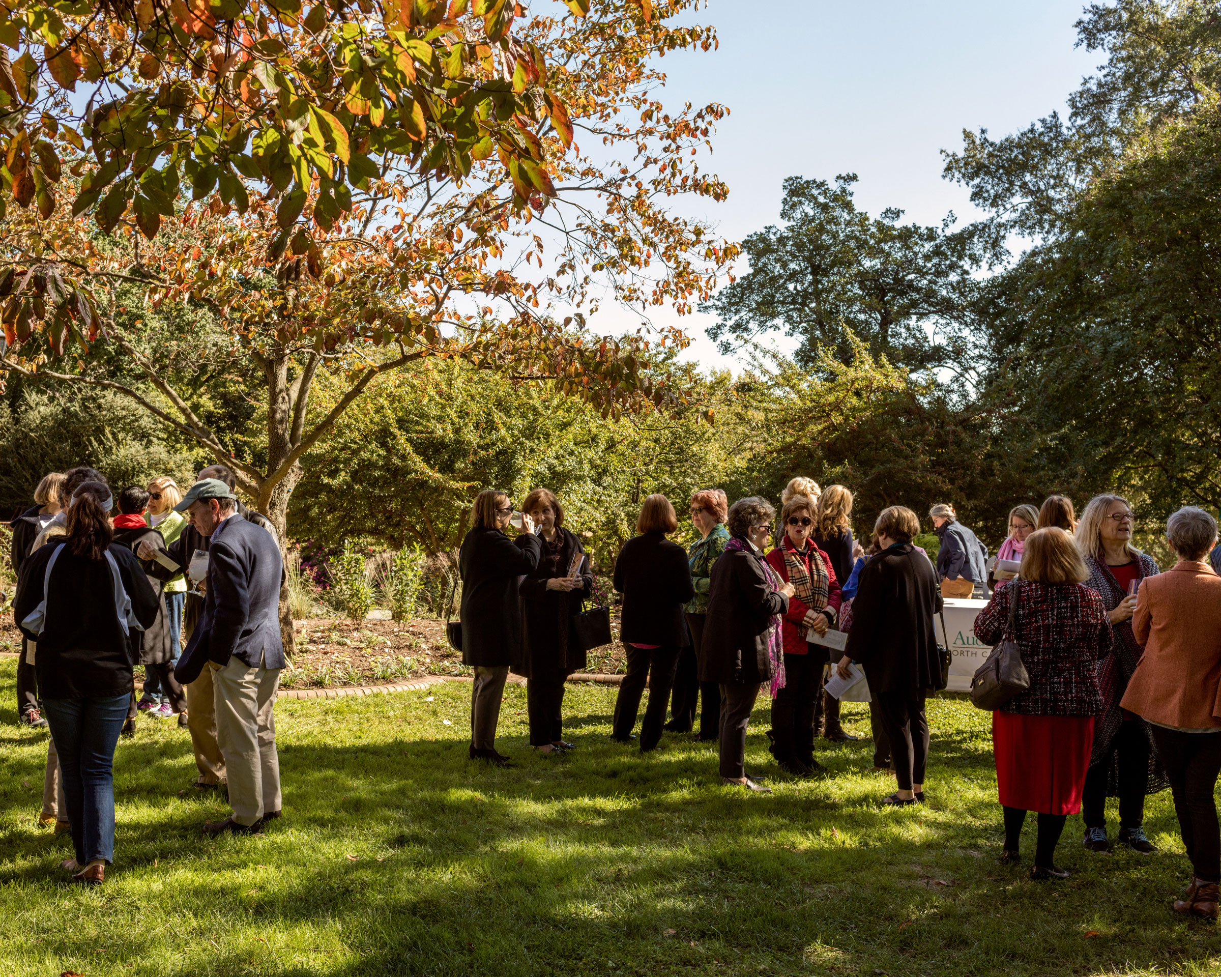 Garden dedication attendees chat mix and mingle before the speakers take the podium. Jeremy M. Lange