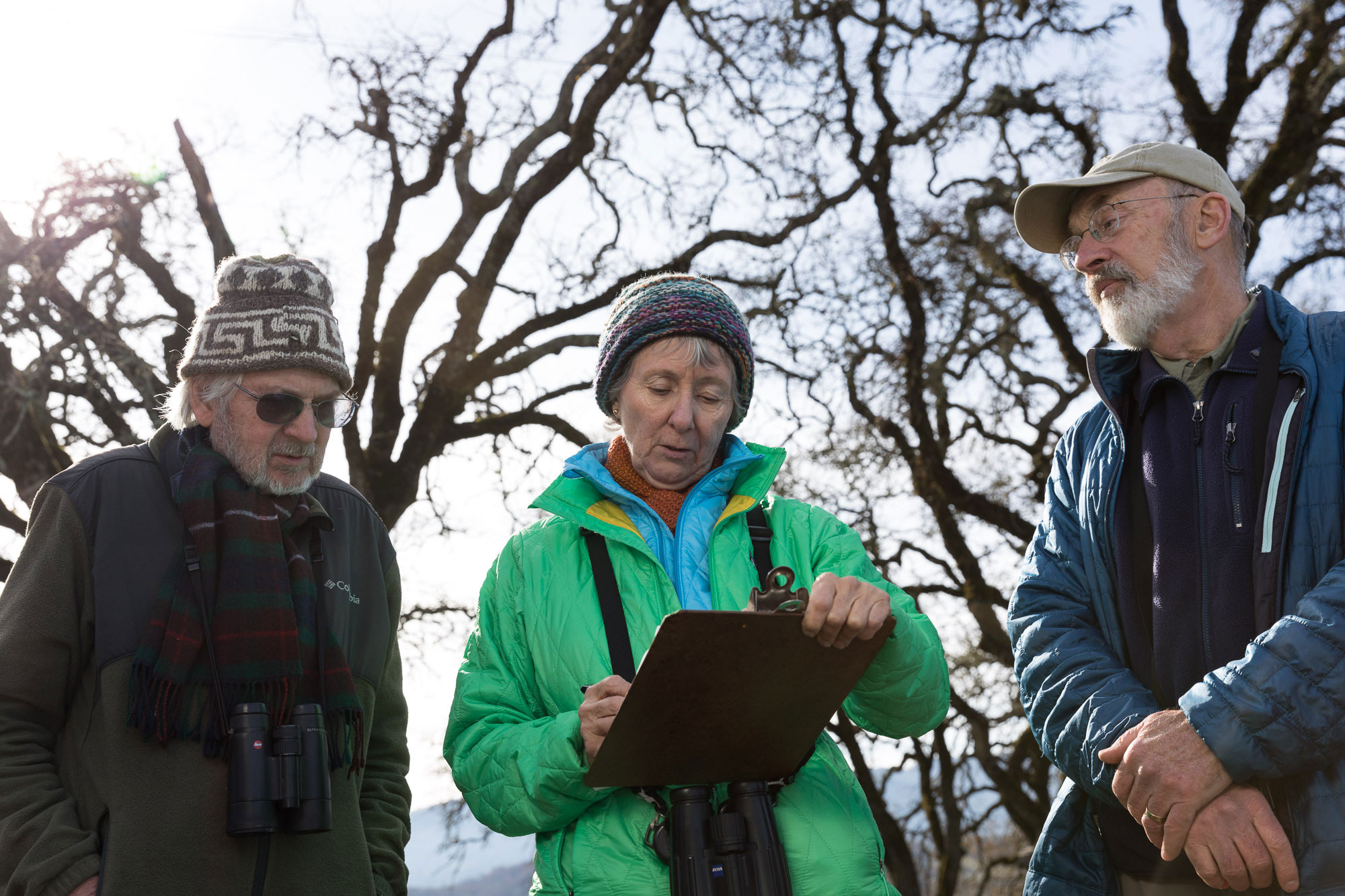 Rodney Jackson, Ann Howland, and David Leland tally birds on the border of Stone Edge Farm and Silver Cloud Vineyard. Ryan Young